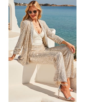 Dress code: dazzling All over sequin embellishment sparkles with every move Cut for a drapey relaxed fit Padded shoulders, ruched sleeves - all the outfit-elevating details Add the matching trousers for maximum impactSlip a silky cami on and accessorise with a glass of something sparkly