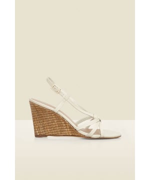 Elevating every summer outfit Chic neutral straps you'll wear with everythingSet on a wear-all-day raffia wedge Adjustable ankle strap for the perfect fit For sightseeing, sundowners and summer occasions Style with everything from swimsuits to summer dresses