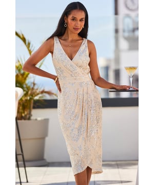 Best-dressed guest guaranteed
Scattered with shimmering sequins
Oh-so-flattering wrap front
Gorgeous gathered skirt
Straps you can wear a bra with
Add extra sparkle with silver heels