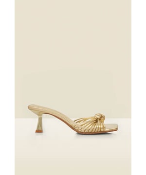 The shoes for every summer occasionDelicate strappy design with a chic knot detailSet on a wear-all-day (and dance-all-night) curved kitten heelTrending square toe silhouetteLuxe metallic gold leather will go with everythingStyle with statement dresses, cool jumpsuits or sleek tailoring