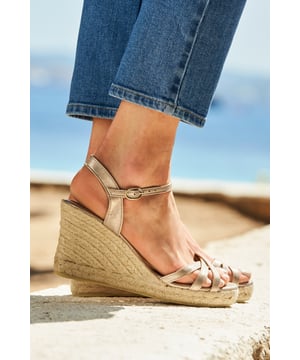 Wedges worth making plans forYour wear-all-night shoesOn-trend champagne goldComfy wedge heelSexy ankle strapJust add your favourite dressWe recommend sizing up as this product runs small