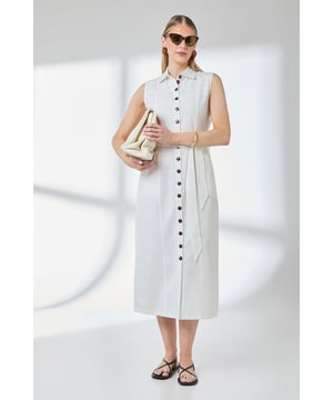 Sleeveless column silhouette with full button-through front design
        Classic collared neckline offering a refined daywear aesthetic
        Crafted from a breathable linen-cotton blend fabric ideal for warmer weather
        Self-tie belt to create a defined waistline and customisable fit
        Midi-length hem falling elegantly below the knee for versatile styling options
    
    This Button Front Shirt Dress from Principles combines timeless design with contemporary comfort. The clean lines of the column silhouette create a naturally flattering shape that works beautifully for a variety of daytime occasions. Style with flat sandals as seen on our model for a relaxed weekend look perfect for farmers' markets or seaside strolls. For a more polished appearance, add a woven tote and delicate jewellery for lunch with friends or family gatherings. The breathable fabric composition ensures all-day comfort even during warmer months, while the button-through design adds practical versatility. This dress transitions effortlessly from casual daywear to smart-casual settings - simply switch your accessories to reflect the occasion. A wardrobe essential that delivers both comfort and style.