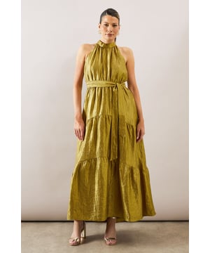 Elegant halterneck design with gathered neckline for a sophisticated silhouette
        Textured organza fabric creates a luxurious, lightweight feel with subtle sheen
        Dramatic tiered maxi skirt adds movement and dimension
        Self-tie waist belt to accentuate and flatter your figure
        Sleeveless cut perfect for showcasing statement jewellery at formal occasions
    
    This stunning Wallis maxi dress combines timeless elegance with contemporary design. The textured organza fabric creates a beautiful drape that flows gracefully with every step, whilst the tiered construction adds captivating dimension to your ensemble. Style with metallic strappy heels and statement drop earrings as shown for a sophisticated wedding guest look. For race day glamour, pair with a fascinator and clutch bag in complementary tones. The halterneck design frames the dcolletage beautifully, making this dress ideal for special occasions where you wish to make an impression. The adjustable waist tie allows for a customised fit that flatters your silhouette, whilst the maxi length offers a refined finish suitable for the most prestigious events in your social calendar.