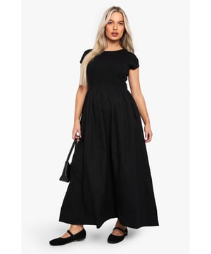Ribbed jersey fabric for comfort and stretch
        Midi length for versatile styling
        Short sleeves for warm-weather wear
        Round neckline for a classic look
        Empire waistline to accommodate growing bump
    
    Embrace your changing silhouette with this chic and comfortable maternity midi dress from Boohoo. The ribbed jersey fabric offers a flattering fit that grows with you, while the empire waistline provides ample room for your blossoming bump. Perfect for casual outings or family gatherings, this dress can be easily dressed up or down. Pair it with flat sandals and a denim jacket for a relaxed daytime look, or add statement earrings and a clutch bag for an effortless evening ensemble. The versatile design ensures you'll feel confident and stylish throughout your pregnancy, making it a wardrobe staple for mums-to-be who don't want to compromise on fashion.