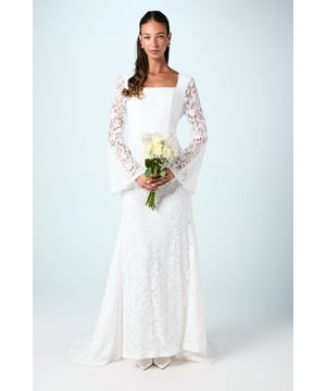 Exquisite lace overlay with intricate floral detailing throughout the gown
        Elegant square neckline framing the dcolletage beautifully
        Dramatic flare sleeves adding a romantic, ethereal touch
        Figure-enhancing silhouette with a graceful flared hem
        Floor-sweeping length creating a sophisticated bridal profile
    
    Make a breathtaking entrance on your special day in this enchanting Coast wedding dress. The delicate lace construction creates a timeless aesthetic whilst the square neckline offers a contemporary twist on traditional bridal wear. The statement flare sleeves add drama and movement as you glide down the aisle, whilst the fitted bodice gracefully flows into a flared skirt that flatters your silhouette. Style with minimal jewellery to let the intricate lace detailing take centre stage - perhaps pearl drop earrings and a simple bracelet. Complete your bridal ensemble with satin court shoes and a cathedral-length veil for the ceremony, then remove the veil for evening celebrations to showcase the beautiful back detail of this unforgettable gown.