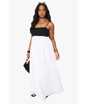 Striking contrast design with fitted bodice and flowing maxi skirt
        Elegant strappy neckline for a flattering silhouette
        Comfortable cotton blend fabric with gentle drape
        Empire waistline creates a lengthening effect
        Floor-length cut perfect for making a statement at casual events
    
    This effortlessly chic maxidress combines comfort with style for your everyday wardrobe. The strappy neckline and empire waist create a feminine silhouette that flatters your curves, while the flowing maxi skirt adds dramatic movement with every step. Style with flat sandals and a clutch bag for family gatherings or weekend brunches, or dress it up with statement jewellery and a denim jacket for evening drinks. The versatile design works beautifully for garden parties, holiday getaways, or casual shopping trips. Add oversized sunglasses and bangles as seen on our model for a complete look that transitions seamlessly from day to night. This Boohoo dress offers the perfect balance of casual comfort and head-turning style for the fashion-forward woman.