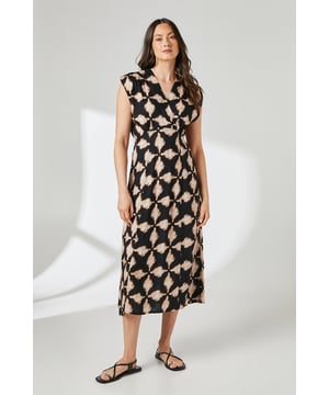 Striking geometric print midi dress with distinctive lapel collar detail
        Flattering cap sleeve design offering comfortable arm coverage
        Elegant midi length that falls gracefully below the knee
        Sophisticated silhouette with subtle waist definition
        Lightweight viscose fabric providing excellent drape and movement
    
    This Principles midi dress showcases a captivating geometric print that makes a statement without overwhelming. The distinctive lapel collar adds a refined touch to the relaxed silhouette, while the cap sleeves create a balanced look suitable for various occasions. Style with strappy sandals as shown for casual daytime gatherings, or transform your look with a denim jacket and trainers for weekend brunches. The versatile midi length works beautifully for family celebrations or informal garden parties. For cooler days, layer with a lightweight cardigan and ankle boots. The flowing viscose fabric ensures all-day comfort whilst maintaining an effortlessly chic appearance, making this dress a wardrobe essential that transitions seamlessly from casual daywear to relaxed evening settings.