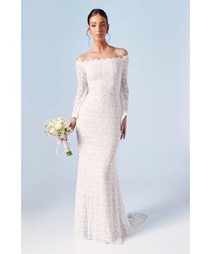 Exquisite lace detailing throughout
        Elegant off-shoulder Bardot neckline
        Figure-hugging fishtail silhouette
        Long sleeves with delicate scalloped edges
        Stunning train for a dramatic entrance
    
    Make a breathtaking entrance on your special day with this enchanting Bardot Boho Lace Fishtail Wedding Dress from Coast. The alluring off-shoulder neckline gracefully frames your dcolletage, while the intricate lace fabric adorns your silhouette with timeless elegance. The form-fitting design culminates in a striking fishtail hem, creating a mesmerising silhouette as you glide down the aisle. For a harmonious bridal look, pair with delicate pearl earrings and a simple veil. Style your hair in a sleek updo to showcase the beautiful neckline, and complete the ensemble with strappy heels. This gown is perfect for brides seeking a blend of bohemian charm and classic sophistication for their wedding ceremony or intimate celebration.
