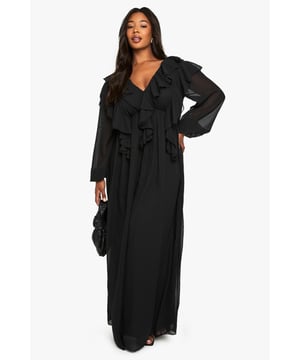 Flowing chiffon maxi-skater dress with dramatic ruffle detailing across the bodice
        Elegant V-neckline complemented by long, billowy sleeves for a romantic silhouette
        Flattering empire waistline that creates a feminine shape
        Striking open back design with delicate tie fastening
        Floor-sweeping length with gentle flare for graceful movement
    
    Make a captivating entrance at your next formal occasion in this enchanting chiffon maxi dress. The cascading ruffles create a sense of drama whilst the flowing skater silhouette ensures comfort throughout your event. Style with strappy heels and a compact clutch as seen on our model for a sophisticated evening ensemble. Perfect for weddings, formal dinners or graduation ceremonies, this dress offers versatility without compromising on elegance. The V-neckline frames the dcolletage beautifully, whilst the open back detail adds an unexpected twist to this otherwise classic piece. For cooler evenings, layer with a tailored blazer or delicate wrap to maintain the refined aesthetic whilst staying comfortable as you dance the night away.