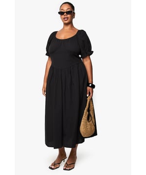 Crafted from breathable linen-look fabric, perfect for warm-weather comfort
        Feminine puff sleeves with delicate gathered detailing at the cuffs
        Flattering scoop neckline that frames the dcolletage beautifully
        Midi-length silhouette with a relaxed, flowing skirt that skims the body
        Gathered waist design creates a defined silhouette with effortless movement
    
    This versatile plus-size midi dress combines casual charm with timeless elegance. The linen-look fabric offers a natural texture that works brilliantly for daytime gatherings whilst maintaining a polished appearance. Style with flat sandals and a woven tote bag as shown for farmers' markets or weekend brunches. For garden parties, pair with espadrille wedges and statement earrings. The gathered waistline creates a flattering shape that works beautifully across body types, while the puff sleeves add a contemporary touch to this classic silhouette. This Boohoo dress transitions seamlessly from casual daywear to relaxed evening occasions - simply swap your accessories and add a denim jacket for cooler evenings. Perfect for holidays, family gatherings or casual Friday workwear when styled with a tailored blazer.