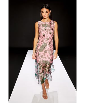 Sleeveless column dress crafted from delicate organza fabric with an eye-catching floral print
        Elegant round neckline offering a sophisticated silhouette
        Striking semi-sheer panel at the hem creating visual interest and dimension
        Figure-flattering column cut that gracefully follows the body's natural lines
        Versatile midi length perfect for various daytime occasions
    
    This captivating RUNWAY 1.8.1.8 dress showcases the beauty of organza with its distinctive floral print and contemporary design. The sleek column silhouette creates a refined daytime look whilst the semi-transparent hem detail adds a touch of modern flair. Style with minimal jewellery as seen on our model - statement earrings are all you need to complement this standout piece. Perfect for garden parties, gallery openings or sophisticated brunches, this dress pairs beautifully with strappy sandals and a structured clutch for daytime events. For cooler weather, layer with a cropped cardigan or tailored blazer. The versatile design transitions effortlessly from family gatherings to casual al fresco dining, making it a wardrobe essential for the fashion-forward woman who appreciates artistic prints and thoughtful details.