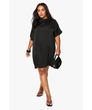 Luxurious satin finish that catches the light beautifully for evening occasions
        Oversized silhouette offering both comfort and contemporary style
        Short, relaxed sleeves with a dropped shoulder for effortless chic
        Versatile t-shirt dress design that can be dressed up or down
        Flattering round neckline that complements statement jewellery
    
    This satin oversized t-shirt dress from Boohoo combines night-out glamour with laid-back comfort. The lustrous fabric creates a sophisticated sheen that's perfect for after-dark adventures, while the relaxed fit ensures you'll feel as good as you look. Style with strappy heels and a compact handbag as seen on our model for a club-ready ensemble, or customise with chunky boots and a leather jacket for edgier drinks with friends. The simple silhouette makes it ideal for accessorising - layer on statement jewellery to transform this versatile piece. The t-shirt dress design offers the ultimate blank canvas for expressing your personal style, whether you're heading to a trendy bar or meeting mates for a spontaneous night out. This dress embodies the perfect balance of effortless and eye-catching - exactly what your going-out wardrobe needs.