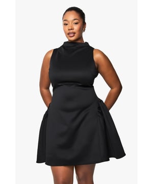 Structured scuba fabric creates a flattering silhouette that holds its shape beautifully
        High neckline with elegant mock-neck design adds sophistication
        Sleeveless cut showcases arms whilst maintaining a refined look
        Voluminous skater skirt creates dramatic movement and playful flair
        Back fastening ensures a smooth, streamlined front appearance
    
    Make a statement after dark in this structured skater dress that combines contemporary design with classic appeal. The mock-neck silhouette and sleeveless cut create a balanced look that's both modern and timeless, whilst the voluminous skirt adds dramatic flair to your night-out ensemble. Style with strappy heels and a compact clutch for drinks with the girls, or dress it up with statement jewellery and a bold cuff bracelet for club nights. The scuba fabric offers just the right amount of structure to maintain the dress's distinctive shape throughout the evening. This versatile piece transitions effortlessly from casual cocktails to more upscale venues-simply switch up your accessories to match the occasion. A true wardrobe hero for the fashion-forward woman who values both style and comfort for her night-time adventures.