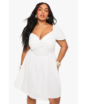 Flattering twist front detail creates a stunning sweetheart neckline
        Soft cotton blend fabric offers comfort and breathability
        Feminine cap sleeves provide just the right amount of coverage
        Classic skater silhouette with a fitted bodice and flared skirt
        Versatile design perfect for day-to-night styling
    
    This charming skater dress combines effortless style with a figure-flattering design. The twist front detail creates a beautiful neckline that draws the eye, whilst the fitted bodice and flared skirt work together to create a balanced silhouette. Style with simple flat sandals and stacked bangles for casual daytime events, or dress up with strappy heels and statement earrings for evening gatherings. The cotton blend fabric ensures this dress remains comfortable throughout the day, making it ideal for family barbecues, brunches with friends, or relaxed garden parties. Layer with a denim jacket when the temperature drops or wear alone to showcase the lovely cap sleeve detail. This Boohoo dress embodies casual chic that works for multiple occasions without compromising on style.