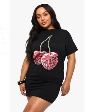 Oversized T-shirt dress with striking leopard print cherry graphic
        Comfortable cotton fabric for all-day wearability
        Relaxed short sleeve design with round neckline
        Mini length silhouette perfect for showcasing your legs
        Versatile piece that can be styled multiple ways for different occasions
    
    Make a bold statement with this playful oversized T-shirt dress from Boohoo. The eye-catching leopard print cherry graphic adds a touch of fun to this casual piece, whilst the relaxed fit ensures maximum comfort without compromising on style. Pair with chunky trainers and a crossbody bag for daytime outings as seen on our model, or dress it up with ankle boots and statement jewellery for evening drinks with the girls. The mini length is perfect for warmer days, but can easily transition into cooler weather when layered with tights and a leather jacket. This versatile dress works brilliantly for family gatherings, casual brunches, or weekend shopping trips - a true wardrobe essential that combines comfort with Boohoo's signature trendy aesthetic.