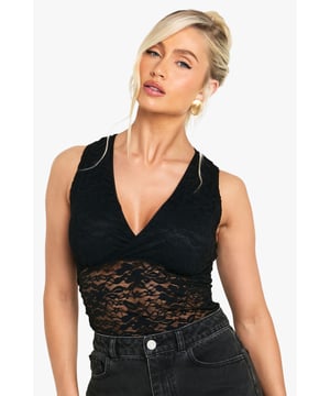 Flattering wrap-style bodice with plunging V-neckline
        Delicate lace detailing across the midriff for a sultry touch
        Sleeveless design with wide shoulder straps for comfort
        Elegant lace back panel adding sophisticated detail
        Versatile bodysuit design that tucks neatly into bottoms
    
    This striking lace bodysuit combines allure with practicality for the fashion-forward woman. The wrap-style front creates a flattering silhouette while the deep V-neckline adds a touch of drama. Style with high-waisted wide-leg jeans as shown for a balanced casual look that's perfect for drinks with the girls or weekend brunches. For evening affairs, pair with a tailored blazer and slim-fit trousers for a sophisticated ensemble. The contrast between the structured bodice and delicate lace detailing makes this Boohoo piece a versatile wardrobe essential that transitions effortlessly from day to night. Complete your look with statement earrings and a sleek updo to showcase the beautiful back detail. This bodysuit works brilliantly layered under cardigans for cooler days or worn alone when you want to make an impression.