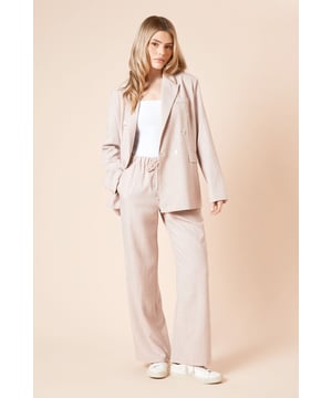 Oversized silhouette with relaxed shoulders for contemporary comfort
        Double-breasted design with striking button detailing
        Classic stripe pattern adds visual interest to this versatile piece
        Practical front pockets for functionality and style
        Collared neckline creates a structured, polished appearance
    
    Make a statement with this Dorothy Perkins oversized stripe blazer, the perfect blend of comfort and sophistication for your daywear collection. The relaxed fit offers a modern take on traditional tailoring, whilst the double-breasted design adds a touch of classic charm. Style with the matching trousers as seen on our model for a coordinated look that's right on trend, or pair with your favourite jeans and a simple white tee for a more casual approach. The blazer works brilliantly for weekend brunches with friends, family gatherings, or those days when you want to feel put-together without trying too hard. Complete the look with trainers for an effortlessly chic outfit that transitions seamlessly from coffee dates to casual meetups. This versatile piece will quickly become a wardrobe favourite for the woman who appreciates contemporary style with a nod to timeless design.