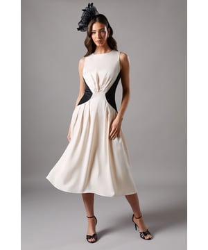 Sleeveless midi dress with striking contrast side panels creating a flattering silhouette
        Elegant round neckline complemented by sophisticated pleating detail at the waist
        Luxurious satin fabric that catches the light beautifully as you move
        Flowing A-line skirt that falls gracefully to a midi length
        Distinctive contrast back panels that mirror the front design for a cohesive look
    
    This Coast midi dress combines timeless elegance with contemporary design through its distinctive contrast panels. The clever placement of the darker side panels creates a figure-enhancing silhouette, while the gathered detail at the waist adds texture and dimension. Perfect for weddings, the races or formal garden parties, this dress radiates sophistication without compromising on comfort. Style with strappy heels and a statement fascinator for classic race day glamour, or pair with refined court shoes and a clutch bag for wedding guest perfection. The versatile midi length works beautifully for daytime events yet transitions effortlessly to evening occasions. Add a tailored blazer or an elegant wrap for cooler weather whilst maintaining the dress's striking silhouette.
