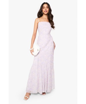 Elegant chiffon maxi dress with delicate floral pattern throughout
        Flattering square neckline with thin adjustable straps
        Figure-enhancing fitted bodice that flows into a graceful floor-length skirt
        Soft flowing silhouette with gentle flare towards the hem
        Perfect occasion wear piece that transitions effortlessly from day to evening events
    
    This enchanting floral chiffon maxi dress from Boohoo captures romantic elegance with its ethereal silhouette. The square neckline frames the dcolletage beautifully, while the fitted bodice creates a flattering shape before cascading into a flowing skirt that moves gracefully with every step. Style with strappy heels and a clutch bag as shown for formal occasions such as weddings or garden parties. For race day events, add a fascinator and delicate jewellery to complete your ensemble. The versatile design works wonderfully for graduations when paired with a tailored blazer, or dress it down for summer soires with a cropped cardigan and metallic sandals. This timeless piece offers endless styling possibilities whilst ensuring you remain the centre of attention at any special event.