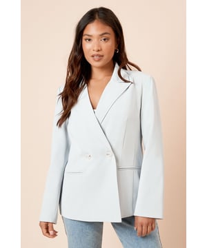 Tailored double-breasted design with sophisticated notched lapels
        Distinctive front seam detailing for a structured silhouette
        Functional front pockets perfect for subtle storage
        Clean-lined finish with a modern, relaxed fit
        Petite proportions designed specifically for smaller frames
    
    This Dorothy Perkins blazer brings refined tailoring to your occasion wardrobe with its elegant seam detailing and contemporary proportions. The double-breasted design creates a flattering shape that works beautifully for formal events whilst maintaining versatility. Style with matching tailored trousers and a silk camisole for weddings or graduations, or dress down with straight-leg denim and white trainers as shown for a sophisticated brunch ensemble. The clean lines and structured shape make this blazer a wardrobe essential that transitions effortlessly from day to evening. Perfect for the woman who appreciates polished style with a modern twist, this piece can be customised with statement jewellery for added personality or kept minimal for timeless elegance at important occasions.