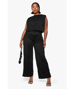 Striking blouson-style top with gathered neckline for a sophisticated silhouette
        Sleeveless design with subtle shoulder padding for structure and definition
        Sheer mesh fabric creates a delicate, contemporary texture
        Wide-leg trousers offer effortless movement and dramatic flair
        Elasticated waistband provides comfortable fit whilst defining the silhouette
    
    Make a statement after dark in this captivating mesh jumpsuit. The blouson top creates a flattering drape that gently skims the body, whilst the wide-leg design delivers maximum impact with every step. Perfect for nights out, this all-in-one solution pairs beautifully with strappy heels and statement earrings as shown on our model. The gathered neckline adds a touch of refinement, making this piece suitable for cocktail parties or club nights alike. For cooler evenings, layer with a cropped jacket or structured blazer to maintain the dramatic silhouette. The versatile design transitions seamlessly from drinks with friends to dancing until dawn - simply switch up your accessories to customise the look for different venues. This Boohoo jumpsuit combines comfort and head-turning style in one effortless package.