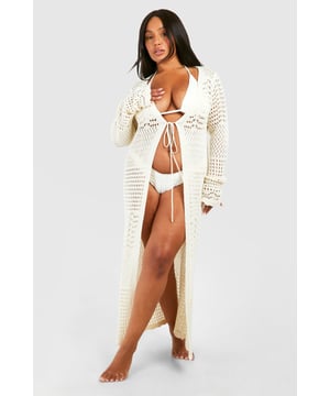 Intricate crochet design for a boho-chic look
        Long, flowing silhouette for graceful movement
        Open-front style with tie closure for adjustable fit
        Wide, flared sleeves add dramatic flair
        Versatile beach cover-up suitable for various body types
    
    Make a statement on your next beach holiday with this stunning crochet kimono. Perfect for throwing over your swimwear, this piece combines comfort and style effortlessly. The intricate crochet pattern adds texture and visual interest, while the flowing silhouette ensures a flattering fit for all body types. Pair it with your favourite bikini for a day by the sea, or dress it up with a slip dress and sandals for beachside cocktails. The open-front design with a tie closure allows for easy wear and a customisable fit. Whether you're lounging by the pool or strolling along the shore, this kimono will keep you looking chic and feeling confident. It's an essential addition to your holiday wardrobe, offering both sun protection and style in one versatile piece.