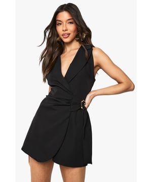 Sleek tailored playsuit with sophisticated wrap neckline for a flattering silhouette
        Distinctive buckle detail at the waist adds a contemporary touch
        Skort design combines the elegance of a skirt with the practicality of shorts
        Tie waist feature creates definition and allows for adjustable fit
        Sleeveless cut with structured shoulders for a polished, evening-ready look
    
    Make a striking impression with this Boohoo buckle detail playsuit that brilliantly bridges the gap between sophisticated and playful. The tailored design with its wrap neckline creates a feminine silhouette whilst the skort element offers both style and comfort for a night out. Perfect for those evening occasions when you want to stand out from the crowd, this piece can be styled with strappy heels and statement earrings as shown for maximum impact. The tie waist and distinctive buckle detail create definition at your narrowest point, whilst the bi-stretch fabric ensures you can move freely on the dance floor. Versatile enough for cocktails with the girls or a special date night, this playsuit delivers confidence and comfort in equal measure. Add a clutch bag and you're ready to command attention wherever the night takes you.