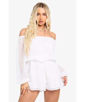 Chic asymmetrical chiffon playsuit with elegant Bardot neckline
        Flowing long sleeves with delicate sheer finish
        Flattering layered design with relaxed silhouette
        Off-shoulder style showcasing dcolletage
        Lightweight fabric perfect for warm-weather styling
    
    This breezy asymmetrical playsuit combines comfort with effortless style for your casual wardrobe. The Bardot neckline gracefully frames your shoulders while the flowing chiffon fabric creates movement with every step. Style with flat sandals as shown for daytime gatherings, or transform your look with strappy heels and statement jewellery for evening drinks. The versatile design works brilliantly for family barbecues, beach outings, or casual brunches with friends. Layer with a denim jacket when temperatures drop, or showcase the elegant neckline with a simple choker necklace. The relaxed fit ensures all-day comfort without compromising on style, making this Boohoo playsuit an essential piece for your summer collection that transitions seamlessly from day to night.