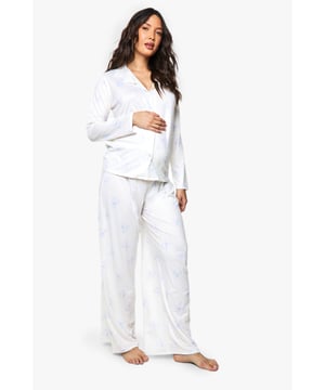 Specially designed maternity pyjama set featuring adorable bear print details
        Button-through top with relaxed fit to accommodate your growing bump
        Long sleeves for extra warmth and comfort during night-time
        Wide-leg trousers with gentle elasticated waistband for maximum comfort
        Soft, breathable fabric ideal for all stages of pregnancy
    
    Drift off to dreamland in absolute comfort with this charming maternity pyjama set from Boohoo. The relaxed button-through top is thoughtfully designed to grow with you throughout your pregnancy journey, whilst the cute bear print adds a playful touch to your nightwear collection. The wide-leg trousers offer unrestricted movement and feature a gentle waistband that sits comfortably below or over your bump. Perfect for lounging at home on lazy Sunday mornings or for a cosy night's sleep, this set combines practicality with style. Layer with a soft dressing gown and fluffy slippers on chillier evenings for the ultimate in night-time comfort. A must-have addition to your maternity wardrobe that doesn't compromise on style or comfort.