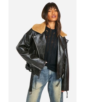 Vintage-inspired biker jacket with faux leather finish
        Cosy borg collar for added warmth and style
        Asymmetrical zip front closure for edgy appeal
        Multiple zipped pockets for practicality and design
        Adjustable waist belt for a customised fit
    
    Channel your inner rebel with this striking vintage-look biker jacket from Boohoo. Perfect for the fashion-forward woman who craves both style and versatility, this jacket is a true wardrobe staple. The faux leather finish gives it a luxe appearance, while the cosy borg collar adds a touch of warmth and texture. Pair it with distressed jeans and a graphic tee for a casual day out, or throw it over a flowy dress for an unexpected edge at family gatherings. The asymmetrical zip and multiple pockets not only serve practical purposes but also contribute to the jacket's overall cool aesthetic. With its adjustable waist belt, you can create a silhouette that flatters your figure. Whether you're heading to a gig or meeting friends for coffee, this jacket will ensure you stand out from the crowd while keeping you comfortably on-trend.