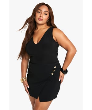 Flattering wrap design with stylish gold-tone button detailing
        Sleek bengaline fabric offers comfortable stretch and shape retention
        Versatile skort design combines the look of a skirt with the practicality of shorts
        Sophisticated V-neckline and sleeveless cut for a feminine silhouette
        Asymmetric hem creates visual interest and a contemporary edge
    
    Make a statement on your next night out with these chic wrap skorts that blend fashion-forward design with practical comfort. The asymmetric wrap front with distinctive button detailing creates a flattering silhouette that accentuates your curves beautifully. Style with strappy heels and a compact handbag as shown for an effortlessly glamorous look perfect for cocktails with the girls. The bengaline fabric offers just the right amount of structure while maintaining comfort for dancing the night away. For cooler evenings, layer with a cropped jacket and add statement jewellery to enhance the gold-tone buttons. These versatile skorts transition seamlessly from casual drinks to upscale venues, making them an essential addition to your going-out wardrobe.