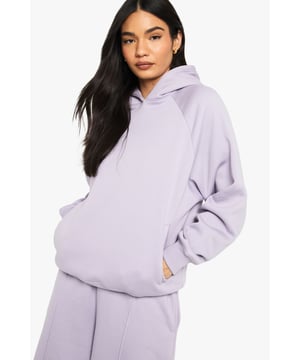 Distinctive raglan seam design for a relaxed shoulder fit
        Oversized silhouette offering ultimate comfort and on-trend styling
        Fleece-back fabric providing warmth without bulk
        Practical front pocket for essentials and hand-warming
        Ribbed cuffs and hem for a secure, flattering fit
    
    The Raglan Seam Oversized Hoodie from Boohoo delivers contemporary casual style with uncompromising comfort. The relaxed raglan construction creates a slouchy, effortless silhouette that's perfect for your off-duty wardrobe. Style with the matching wide-leg joggers as seen on our model for a coordinated loungewear look that transitions seamlessly from sofa to street. For casual outings, pair with your favourite trainers and a roomy tote bag. The hoodie's generous proportions make it ideal for layering over a simple vest or tee when temperatures drop. A versatile staple for weekend brunches, university lectures, or relaxed family gatherings - this hoodie combines fashion-forward styling with the laid-back comfort that defines modern British casualwear.