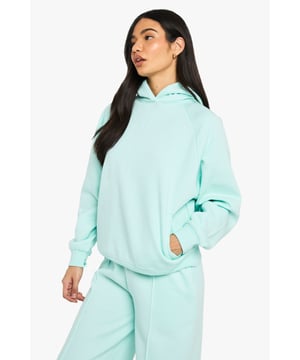 Oversized silhouette with raglan seam detailing for a relaxed, contemporary look
        Fleece-back fabric provides exceptional warmth and softness for ultimate comfort
        Spacious hood offers additional coverage and casual styling options
        Practical side pockets perfect for keeping essentials close at hand
        Ribbed cuffs and hem create a snug fit that retains shape throughout wear
    
    This Boohoo Raglan Seam Oversized Hoodie delivers effortless style with maximum comfort. The relaxed, oversized fit paired with distinctive raglan seams creates a fashionable silhouette that works brilliantly for casual outings. Style with wide-leg joggers as shown for a coordinated loungewear ensemble, or pair with cycling shorts and trainers for a quick coffee run. The fleece-back fabric makes this hoodie ideal for layering during cooler months - try wearing it under an oversized denim jacket with leggings for added warmth. Perfect for family gatherings, weekend brunches or casual cinema trips, this versatile piece transitions seamlessly from home comfort to street style. For a contemporary twist, roll the sleeves slightly and accessorise with layered necklaces to personalise your look.