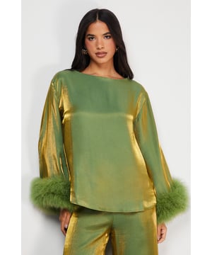 Oversized silhouette for a relaxed and comfortable fit
        Luxurious iridescent feather cuffs add a touch of glamour
        Woven fabric offers a polished and refined appearance
        Long sleeves provide elegant coverage for formal occasions
        Versatile design suitable for various upscale events
    
    Make a statement at your next formal event with this captivating oversized top from Warehouse. The loose fit creates a flattering silhouette that drapes beautifully, while the woven fabric ensures a sophisticated look. The standout feature is undoubtedly the iridescent feather cuffs, which catch the light and add a mesmerising touch to your ensemble. Perfect for weddings, races, or graduations, this top can be styled in multiple ways to suit your personal taste. Pair it with tailored trousers and stilettos for a chic evening look, or dress it down with wide-leg palazzo pants and strappy sandals for a more relaxed yet equally elegant outfit. The versatility of this piece makes it a valuable addition to any fashion-forward wardrobe, allowing you to create memorable looks for various special occasions.