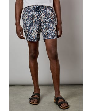 Eye-catching sunset camo print design for standout poolside style
        Quick-drying fabric for comfort both in and out of the water
        Adjustable drawstring waist for a customised fit
        Practical side pockets for essentials
        Mid-thigh length offering comfortable coverage and freedom of movement
    
    These Burton swim shorts showcase a distinctive sunset camo print that brings character to your holiday wardrobe. Perfect for beach days, pool parties or casual summer outings, they offer both style and practicality. The mid-thigh length presents a modern silhouette that suits most body types, while the adjustable waistband ensures comfort throughout the day. Style them as seen with a crisp white t-shirt and sandals for an effortless daytime look, or pair with a linen shirt when heading from beach to bar. These versatile shorts transition seamlessly from swimming to socialising, making them an essential for summer getaways, garden barbecues or simply relaxing at your local lido. Ideal for the man who appreciates classic styling with a contemporary twist, these swim shorts will become a seasonal favourite in your warm-weather collection.