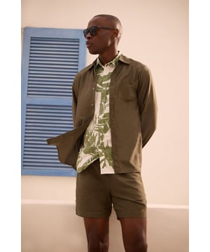 Linen blend fabric offers breathable comfort for warmer days
        Relaxed fit with mid-thigh length for easy movement
        Adjustable drawstring waist for a customised fit
        Side pockets for practicality and casual styling
        Back pocket detail adds functional finishing touch
    
    These versatile linen blend shorts are the cornerstone of any summer wardrobe. Perfect for casual weekend outings, they pair effortlessly with a crisp white tee and matching shirt as shown for a coordinated look that works brilliantly for beer garden meetups or family barbecues. The textured fabric adds subtle interest while maintaining a classic appeal that Burton is known for. Style with leather sandals for relaxed holiday vibes, or switch to canvas trainers for a sportier aesthetic when heading to the pub with mates. For cooler evenings, simply add a light knit or casual bomber jacket. These shorts strike the ideal balance between comfort and style - making them an essential for the man who appreciates timeless casual wear with practical features for everyday life.