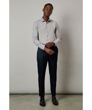 Slim fit design with a tailored silhouette that contours to your frame
        Easy iron fabric technology for effortless maintenance and crease-free wear
        Classic collar with structured points for a refined appearance
        Long sleeves with adjustable button cuffs for versatile styling options
        Subtle button placket with tonal buttons for a sleek, contemporary finish
    
    This Burton shirt combines practicality with polished style, making it a wardrobe essential for the modern gentleman. The slim fit creates a sharp silhouette without sacrificing comfort, whilst the easy iron technology ensures you'll look impeccable with minimal effort. Perfect for the office paired with tailored trousers as shown, or dressed down with dark denim for after-work drinks. The versatile design transitions seamlessly from important meetings to smart casual events - simply remove your tie and open the top button for a more relaxed look. For cooler evenings, layer under a fine merino jumper or structured blazer to maintain that sophisticated edge. This shirt represents the hallmark of Burton's commitment to creating reliable, stylish staples that work as hard as you do.