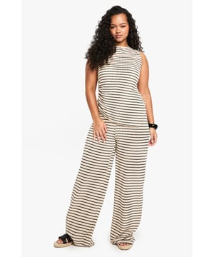 Striking striped pattern for a bold, eye-catching look
        Wide-leg silhouette offers comfort and style
        High-waisted design with drawstring for adjustable fit
        Soft jersey fabric ensures all-day comfort
        Versatile piece suitable for various casual occasions
    
    Make a statement with these trendy wide-leg trousers, perfect for the fashion-forward woman who values both style and comfort. The eye-catching striped pattern adds a touch of flair to your ensemble, while the relaxed wide-leg cut ensures ease of movement. Pair these trousers with a cropped top and oversized sunglasses for a chic daytime look, or dress them up with a fitted blouse and statement jewellery for a casual evening out. The high-waisted design with an adjustable drawstring allows for a customised fit, making these trousers suitable for a range of body types. Ideal for family gatherings, brunches with friends, or a day of shopping, these versatile trousers will quickly become a staple in your wardrobe. The soft jersey fabric promises comfort throughout the day, whether you're running errands or lounging at home. Complete the look with flat sandals or trainers for an effortlessly cool vibe that embodies the Boohoo spirit.