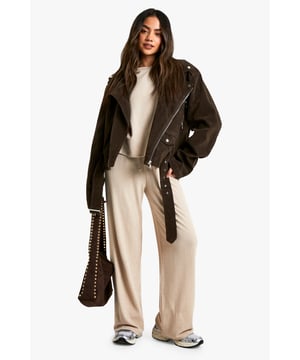 Oversized T-shirt with relaxed fit and dropped shoulders
        Wide-leg trousers with comfortable, flowy silhouette
        Coordinated set for effortless style
        Drawstring waist on trousers for adjustable fit
        Versatile neutral tone suitable for various occasions
    
    Embrace laid-back chic with this effortlessly cool oversized T-shirt and wide-leg trouser co-ord from Boohoo. The relaxed fit of the top, featuring dropped shoulders, pairs perfectly with the flowy silhouette of the trousers, creating a harmonious ensemble that's both comfortable and on-trend. Ideal for casual outings or lounging at home, this set can be easily dressed up or down. Style it with trainers and a leather jacket for a street-smart look, or pair with statement jewellery and heeled sandals for a more polished appearance. The drawstring waist on the trousers allows for a customised fit, while the neutral tone of the set offers endless styling possibilities. Whether you're meeting friends for brunch or running errands, this co-ord set promises to keep you looking effortlessly stylish without compromising on comfort.