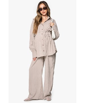 Wide leg maternity trousers with flattering silhouette for growing bumps
        Coordinating belt detail to adjust fit throughout pregnancy
        Vertical stripe pattern creates an elongating effect
        Comfortable high-rise waistband sits above the bump
        Designed to be paired with matching striped shirt for a coordinated look
    
    These boohoo maternity trousers combine comfort and style with their relaxed wide-leg design. The adjustable belt allows you to customise the fit as your body changes, while the vertical stripes create a lengthening effect for a flattering silhouette. Style with the matching button-up shirt for an on-trend coordinated set that works brilliantly for casual outings. For daytime gatherings, pair with simple trainers and oversized sunglasses, or dress up with ballet flats and delicate jewellery for family occasions. The versatile design transitions seamlessly between seasons-layer with a lightweight cardigan when temperatures drop or wear alone during warmer months. These trousers offer the perfect balance of comfort and contemporary style for the fashion-forward mum-to-be.