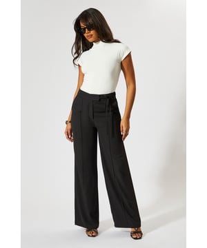 Wide leg silhouette for a relaxed, on-trend look
        Tie-side detail adds a unique, customisable touch
        High-waisted design for a flattering fit
        Tailored construction offers a polished appearance
        Side pockets for practicality and style
    
    Make a statement with these wide leg tie side tailored trousers from MissPap. Perfect for the fashion-forward woman who loves to stand out, these trousers blend comfort with chic style. The high-waisted design elongates your silhouette, while the wide leg cut creates a dramatic, flowing effect as you move. Dress them up for a night out with a crop top and strappy heels, or keep it casual for daytime events with a fitted tee and trainers. The tie-side detail allows you to adjust the fit to your liking, adding a personalised touch to your look. Whether you're heading to a family gathering or meeting friends for brunch, these versatile trousers will ensure you're always dressed to impress. Pair with a sleek blazer for a more formal occasion, or throw on an oversized jumper for a cosy yet stylish ensemble.