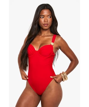 Striking balconette design with structured cups for enhanced shape and support
        Elegant sunshine detail on strap adds a distinctive touch to this swimwear piece
        Flattering high-cut leg line elongates the silhouette
        Adjustable shoulder straps for a customised fit
        Sleek, streamlined design with a smooth finish for a confident poolside look
    
    Make a statement by the pool or on the beach with this eye-catching balconette swimsuit. The structured cups create a flattering silhouette whilst providing excellent support for all-day comfort. The distinctive sunshine detail adds a playful yet sophisticated touch that catches the light beautifully as you lounge by the water. Style with oversized sunglasses and a wide-brimmed hat for ultimate holiday glamour, or layer under a sheer kaftan for elegant poolside drinks. Perfect for everything from active swimming to leisurely sunbathing, this versatile swimsuit transitions effortlessly from day to evening with the addition of a flowing maxi skirt and statement jewellery. The timeless design ensures this piece will remain a holiday favourite for seasons to come.