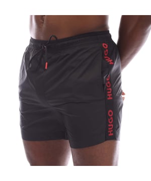 Mens Hugo Fab Logo Tape Swim Shorts in black.- Elasticated waistband.- Side pockets.- Patch pocket.- Trimmed with logo tape on the side seams.- Regular fit.- 100% Polyamide.- Ref: 50500973001