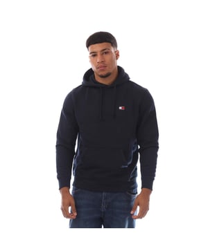 Mens Tommy Hilfiger Tonal Badge Drawstring Hoodie in navy.- Drawstring hooded neck.- Kangaroo pocket.- Rib-knit cuffs and hem.- Tonal Tommy badge patch on chest.- Tommy Jeans branding.- Regular fit.- 100% Cotton.- Ref.: DM0DM20258C1G