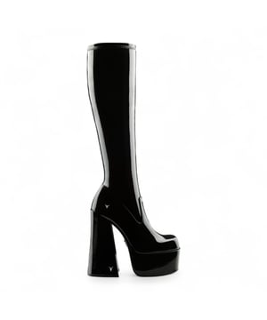 Own the spotlight in the Windsor Smith Saucy black stretch platform boots. These striking knee-high sock boots feature a sleek, non-leather upper that hugs the leg for a bold, sculpted silhouette. Set on towering 15.2 cm chunky block heels with a 5.7 cm platform, they offer dramatic height without compromising stability. Complete with Windsor Smith's iconic bullhead logo on the heel and sole, these boots are designed to turn heads and elevate your wardrobe.

Upper: Black Stretch (Non-Leather)
Lining: Non-Leather
Sole: Non-Leather
Style: Knee-high sock boots
Heel Height: 15.2 cm
Platform Height: 5.7 cm
Design: Chunky platform block heel