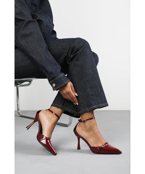 Make a bold entrance with these Katherine Strappy Pointed Toe High Heels, crafted for standout sophistication. Featuring a pointed toe, slim stiletto heel, and delicate buckle straps, they bring timeless elegance with a modern twist. The glossy finish adds a luxurious edge, perfect for evening events, date nights, or dressing up denim.  Key Features: • Material: High-shine patent faux leather upper • Design: Pointed toe with dual buckle strap and stiletto heel • Closure: Adjustable ankle and front buckle straps