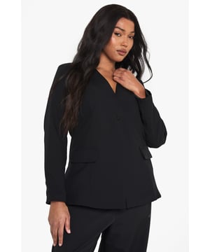 Striking plunge neckline for a bold, contemporary silhouette
        Structured shoulders create a flattering, defined shape
        Practical front pockets add functionality to this stylish piece
        Long sleeves with clean-cut finish for a sophisticated look
        Versatile design perfect for transitioning from day to night
    
    Make a statement with this curve-enhancing blazer featuring a daring plunge neckline that commands attention. The tailored fit creates a sleek silhouette whilst the structured design offers a contemporary twist on classic tailoring. Style with the matching wide-leg trousers as seen on our model for a coordinated evening ensemble, or pair with your favourite jeans and heels for drinks with the girls. For club nights, accessorise with statement earrings and a clutch bag to showcase the blazer's dramatic neckline. This versatile piece works brilliantly for urban nightlife settings where you want to project confidence and style without compromising on comfort. The clean lines and unfussy detailing ensure this blazer remains a wardrobe staple that you'll reach for time and again when planning your going-out looks.