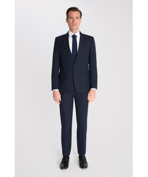 Elevate your wardrobe with the Fawn Suit — a refined two-piece designed for modern elegance. The light-weight fabric offers a crisp, contemporary edge while maintaining timeless versatility.
Cut in a slim fit, the single-breasted blazer features a notch lapel, two-button closure, and flap pockets for a clean, tailored silhouette. The matching flat-front trousers are designed for both comfort and structure, making this suit ideal for weddings, weekend events, or polished office days.
Crafted for those who appreciate style without the fuss, this suit delivers sophistication with ease — lightweight, breathable, and finished for minimal maintenance.
Key Features:
Slim fit with clean tailoring.
Light-weight fabric.
Notch lapel, single-breasted design.
Flat-front trousers with pressed creases.
Easy-care and wrinkle-resistant finish.
Lining 100% Polyester.
Dry clean only.
This suit comes nested, meaning the trousers will have a 6-inch difference to the jacket (e.g.: Jacket- 38R | Trousers - 32R).