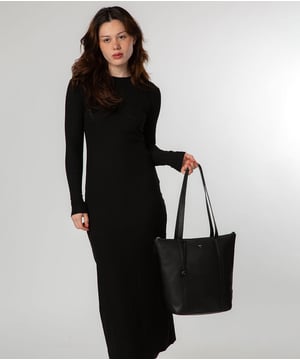 Handcrafted from natural leather with a soft to the touch pebble grain finish, the 'Lara' tote bag from NiNa Amora is a sophsitcated take on this classic design. A spacious lined main compartment is secured with a zip-over top which opens to reveal additional storage in the form of zipped and slip pockets, perfect for maintaining an organised accessory. Dual slim leather handles adorn this style with a drop length of 30cm. This style is finished with silver metal fittings and zips alongside the NiNa Amora logo embossed in silver foil on front and hanging charm; a luxurious finishing touch.
