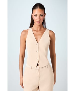 Sleek V-neck design for a flattering silhouette
        Tailored fit accentuates the waistline
        Button-front closure for easy wear
        Versatile sleeveless style perfect for layering
        Crafted from lightweight crepe fabric for comfort
    
    Embrace sophistication on your special day with this exquisite bridal waistcoat from Coast. The tailored fit creates a sleek silhouette, while the V-neck design adds a touch of elegance. Perfect for the modern bride who desires a chic alternative to traditional gowns, this waistcoat can be styled in various ways to suit your wedding vision. Pair it with wide-leg trousers and a matching blazer for a contemporary bridal suit, or layer it over a flowing skirt for a unique twist on classic bridal attire. The versatile nature of this piece allows for seamless transition from ceremony to reception, ensuring you look impeccable throughout your celebration. Accessorise with delicate jewellery and a sleek updo to complete your refined bridal ensemble.
